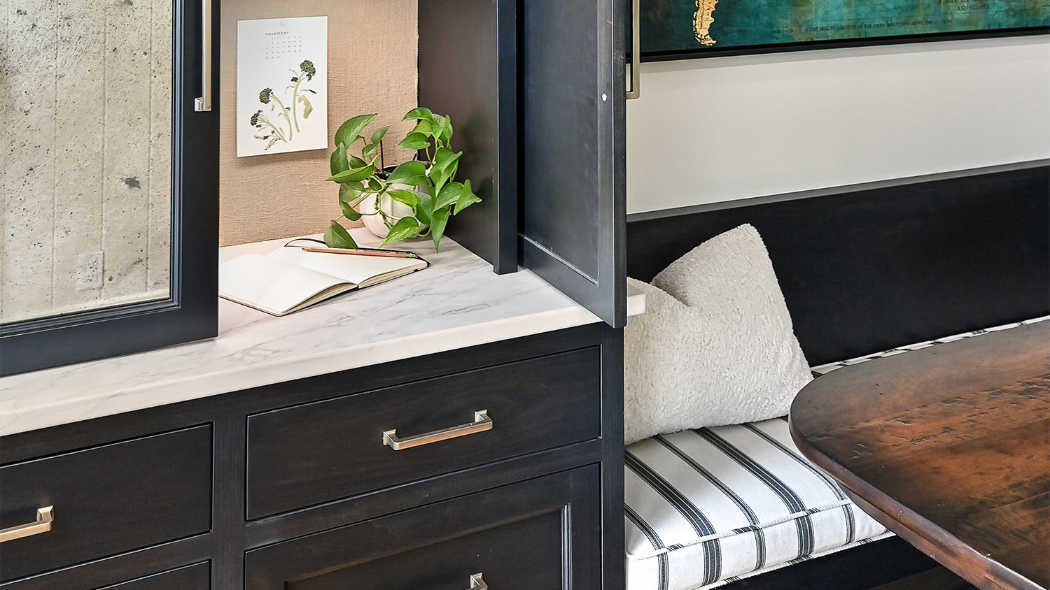 Dark drawers wooden table pillow bend.