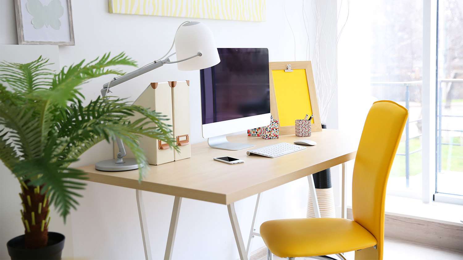 Sunny window desk yellow chair.