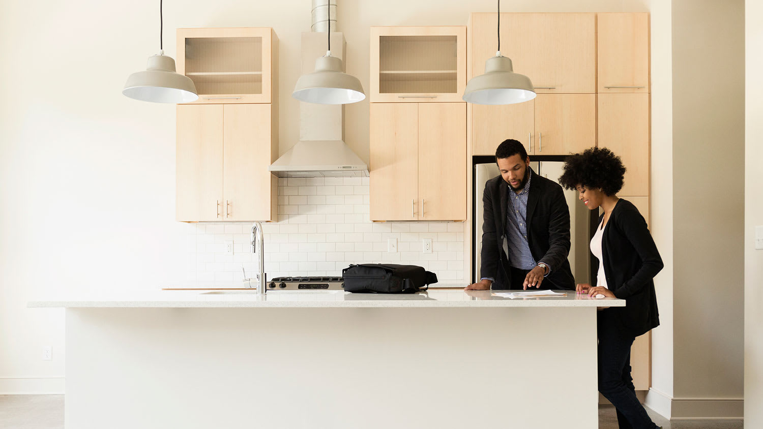 Agent and client reviewing apartment lease