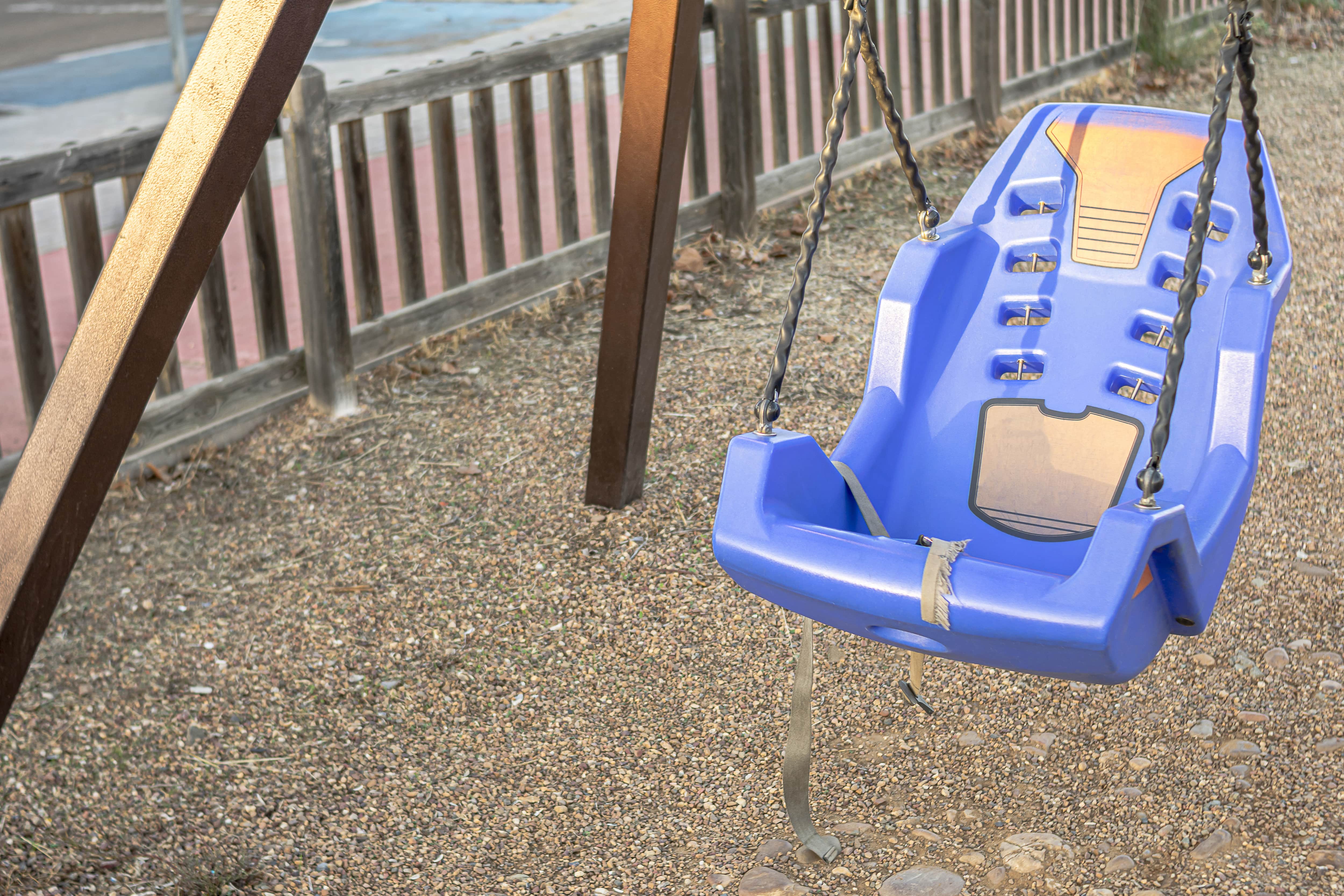 Pea gravel underneath a swing set