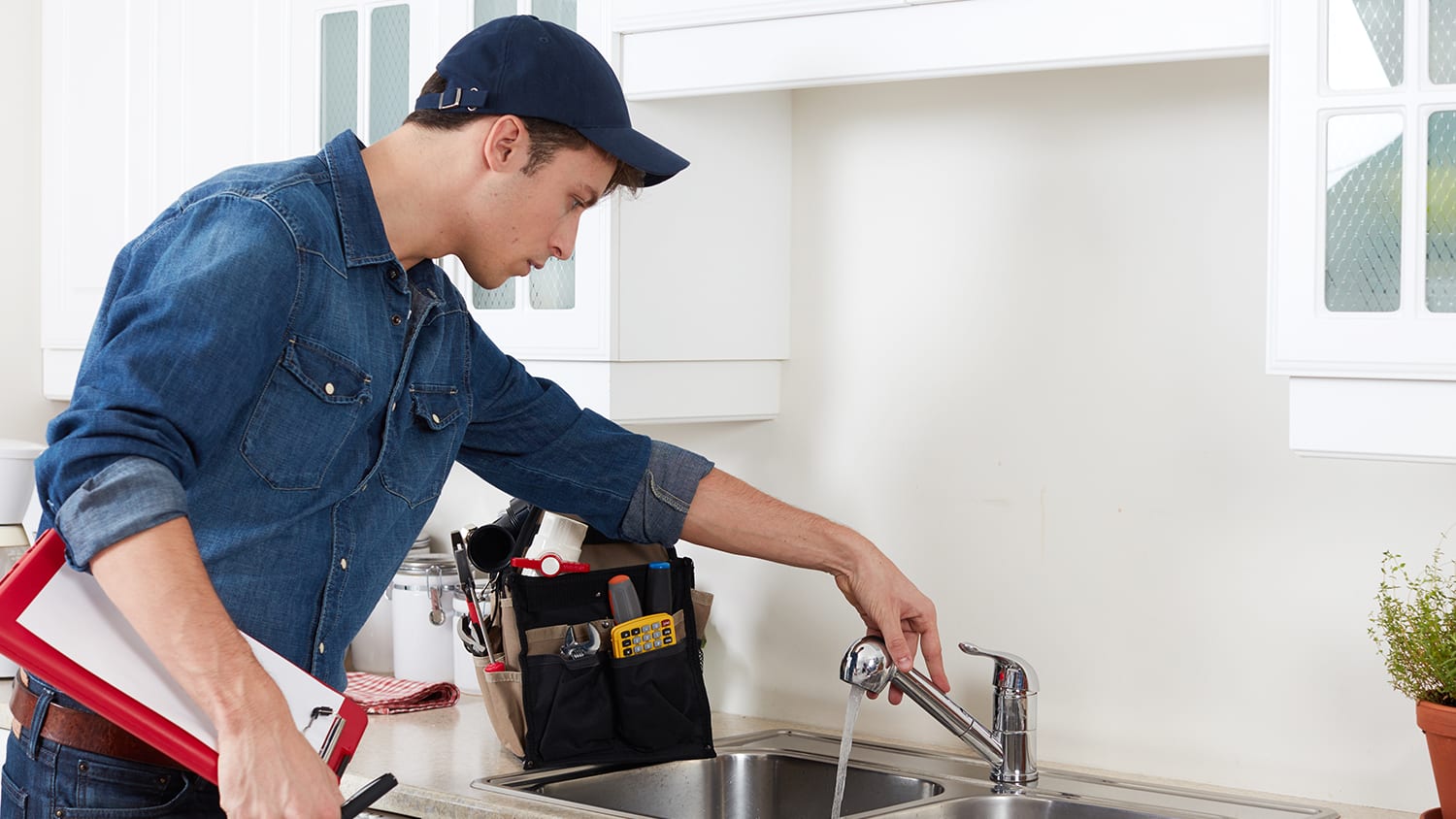 Person repairing the kitchen sink