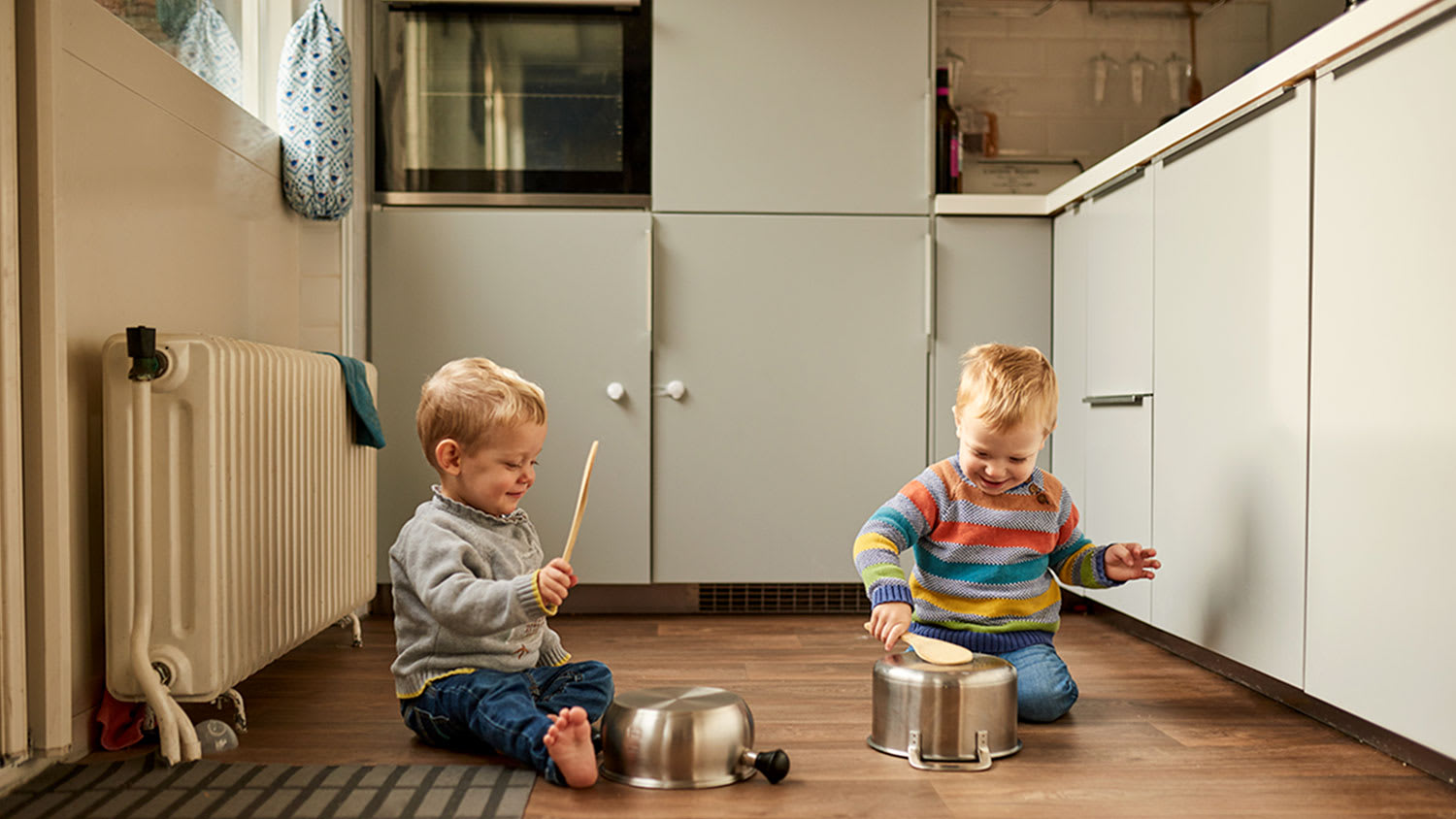 Children playing in kitchen