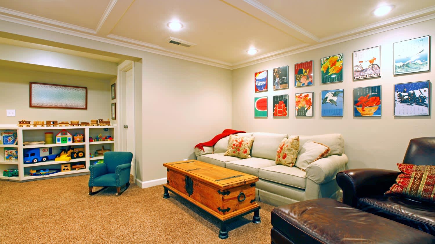 A play room in a white basement living room