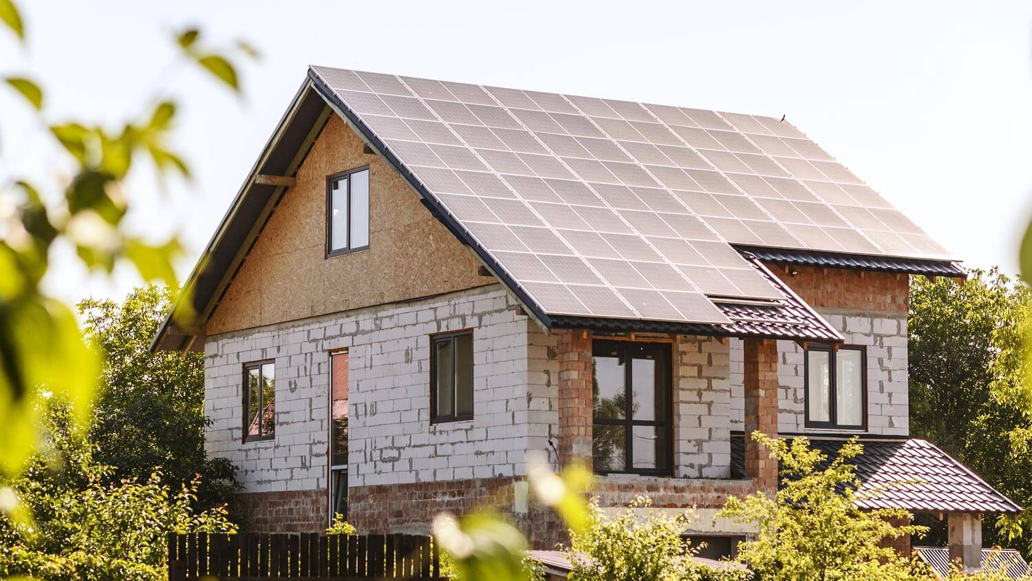 A suburban house with solar panels on the roof
