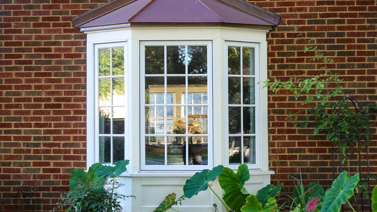 close up bay windows on brick house