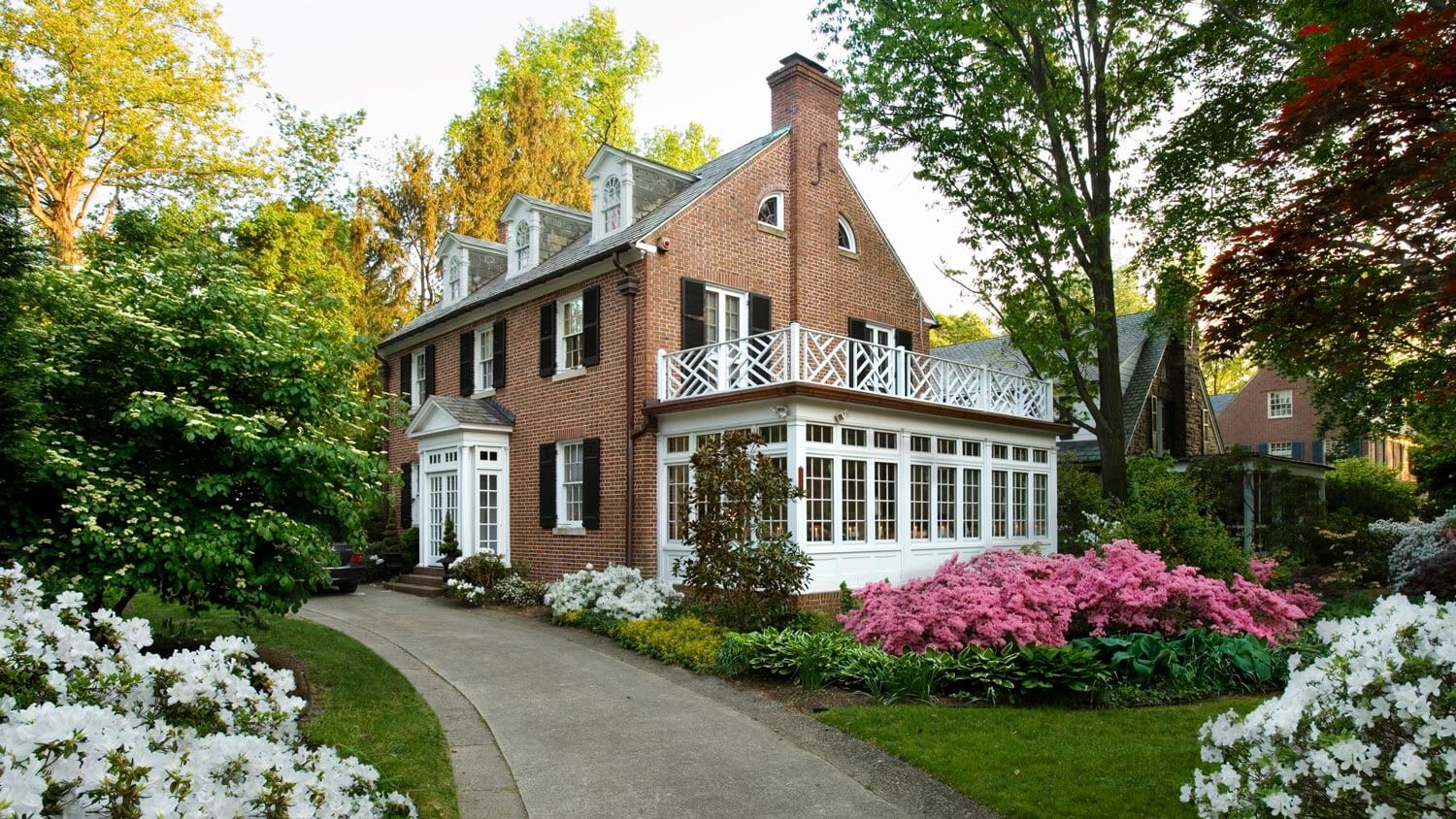 The exterior of a colonial house in spring