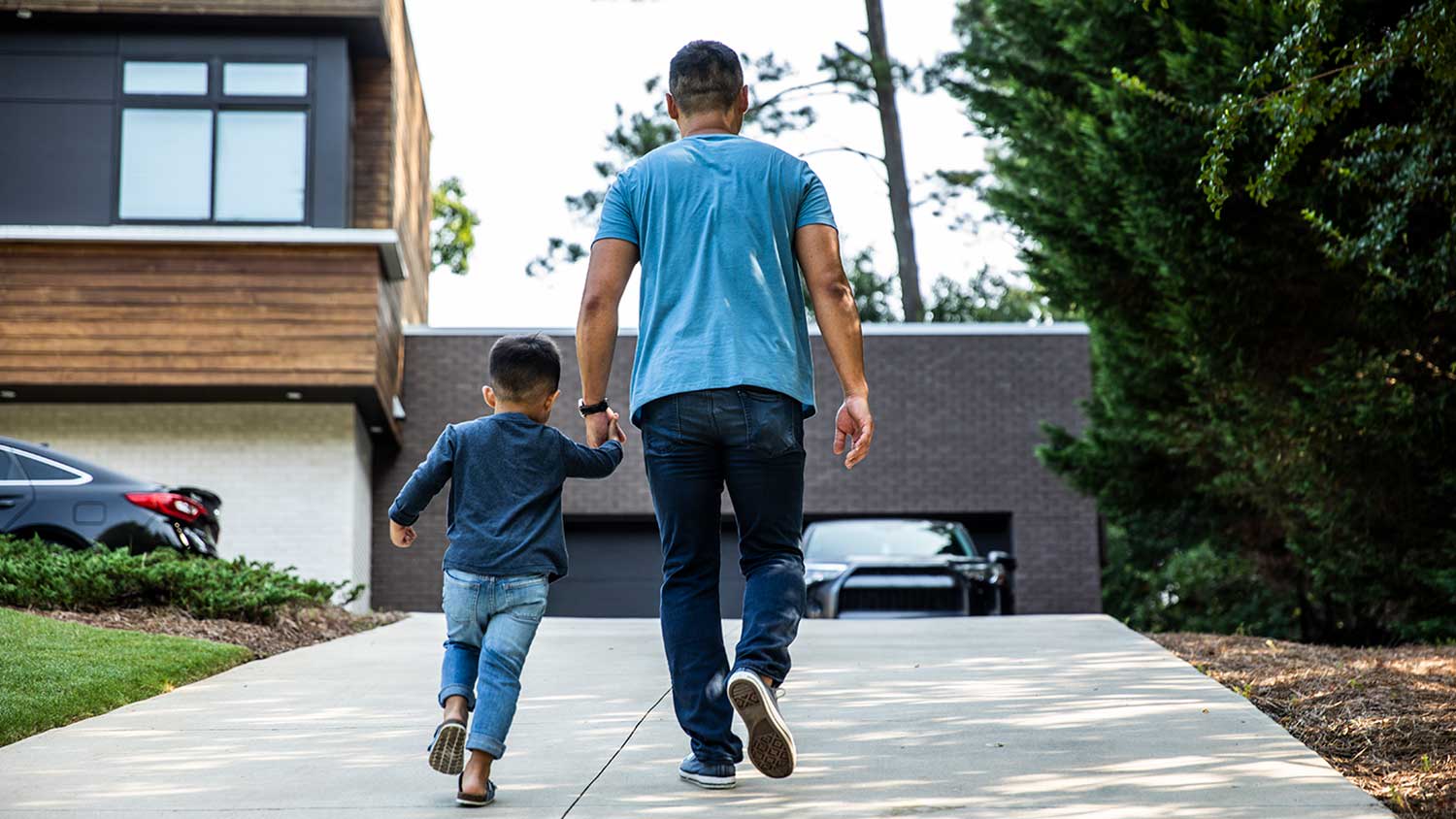 Father and son walking home