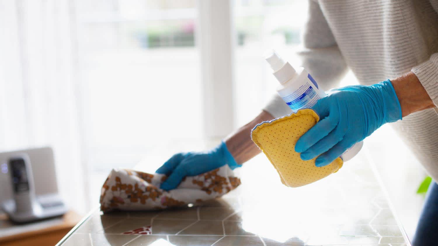 A woman cleaning a table