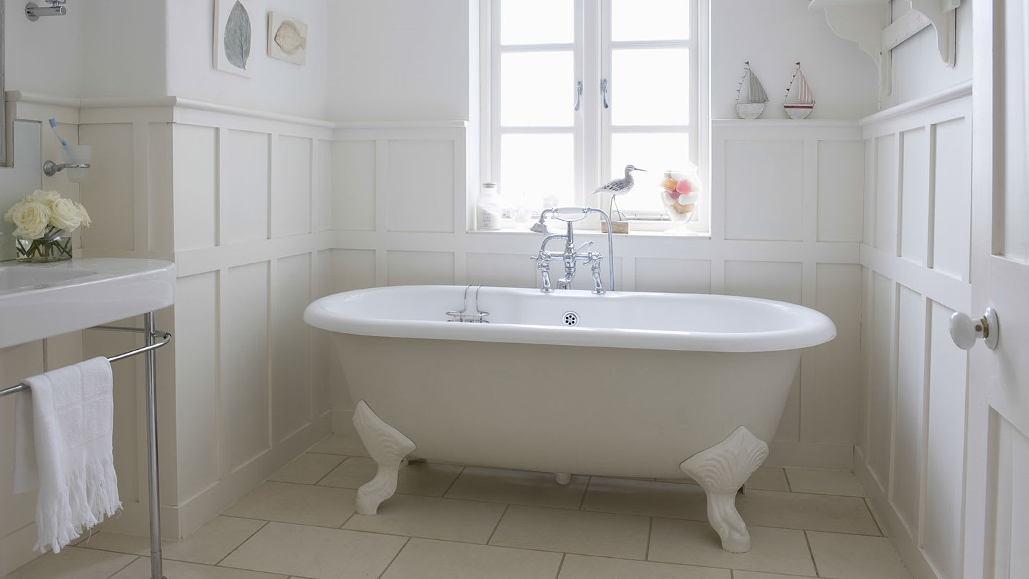 Clawfoot tub in white bathroom