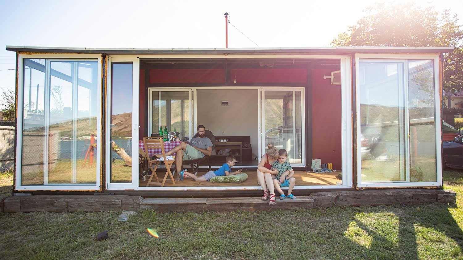 Family outside tiny house
