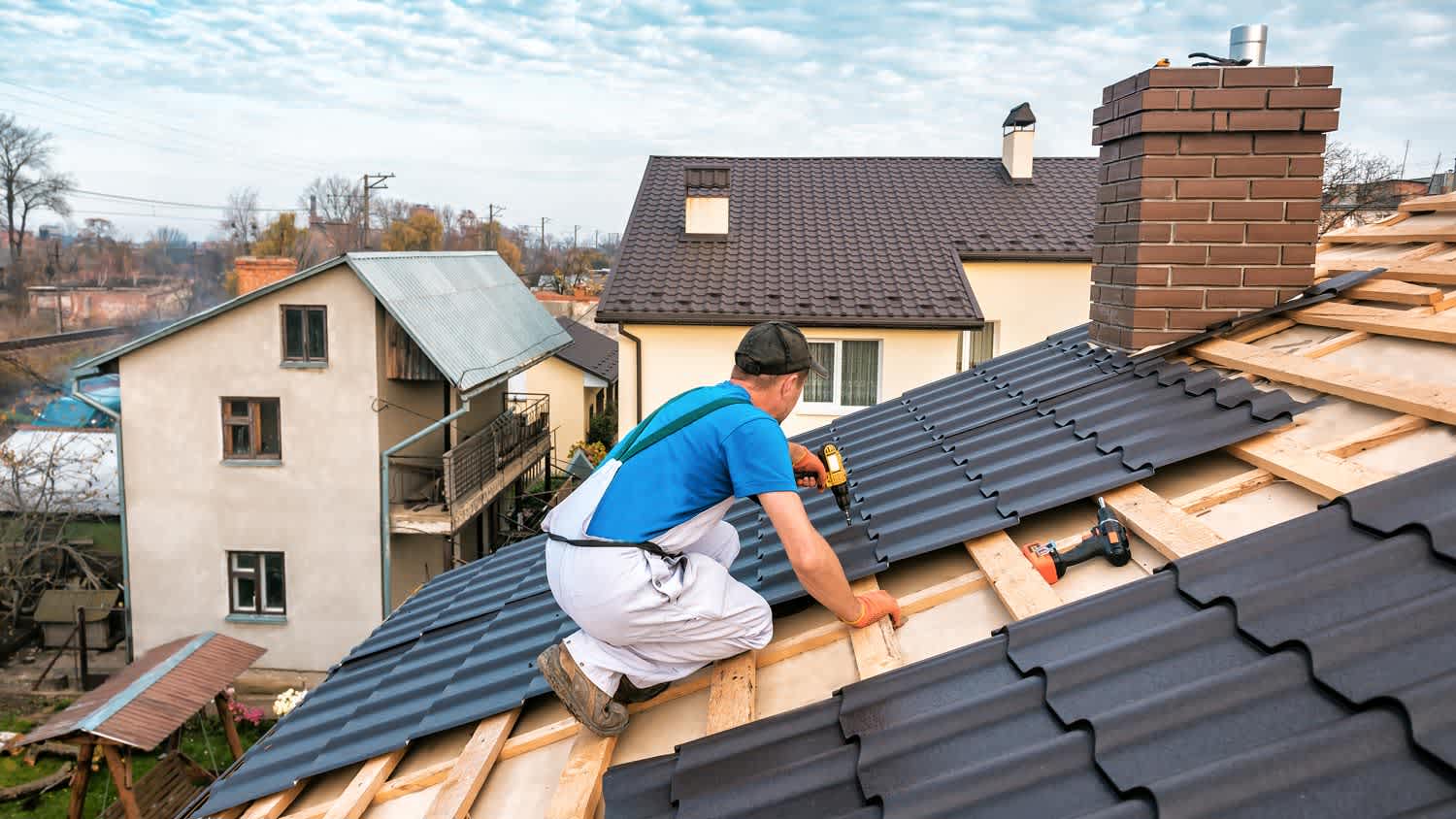 A professional installing new metal roof