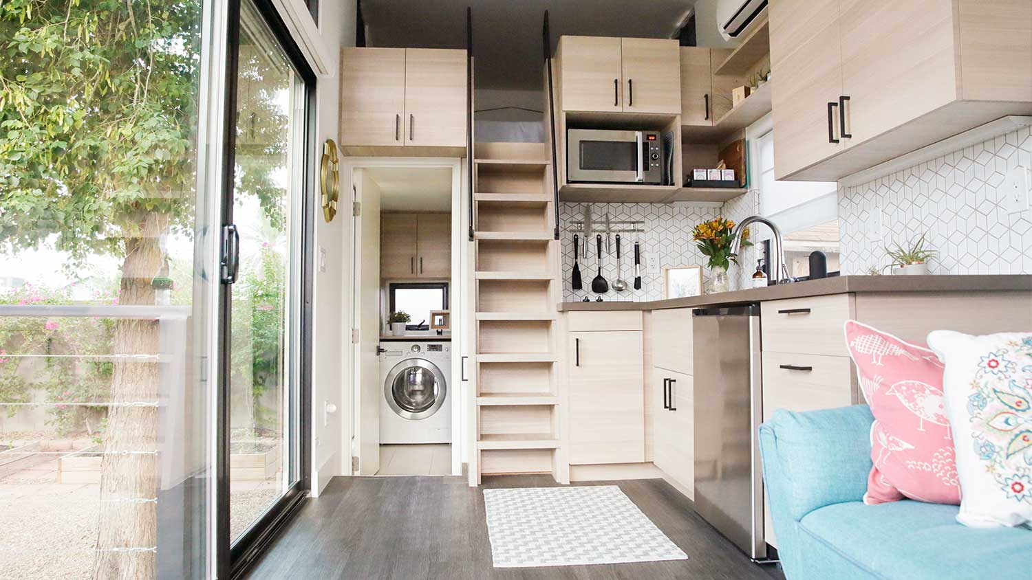 tiny house interior living space with kitchen and washer and dryer