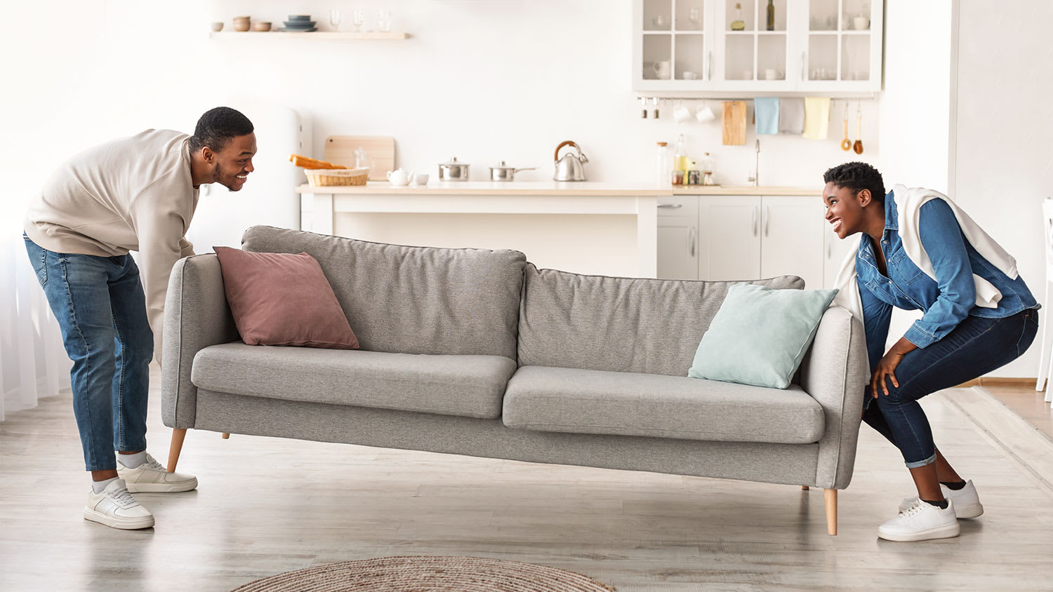 Couple rearranging furniture