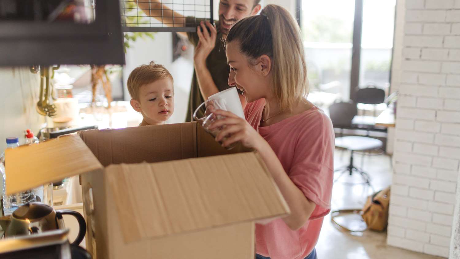 A family packing plates in the kitchen