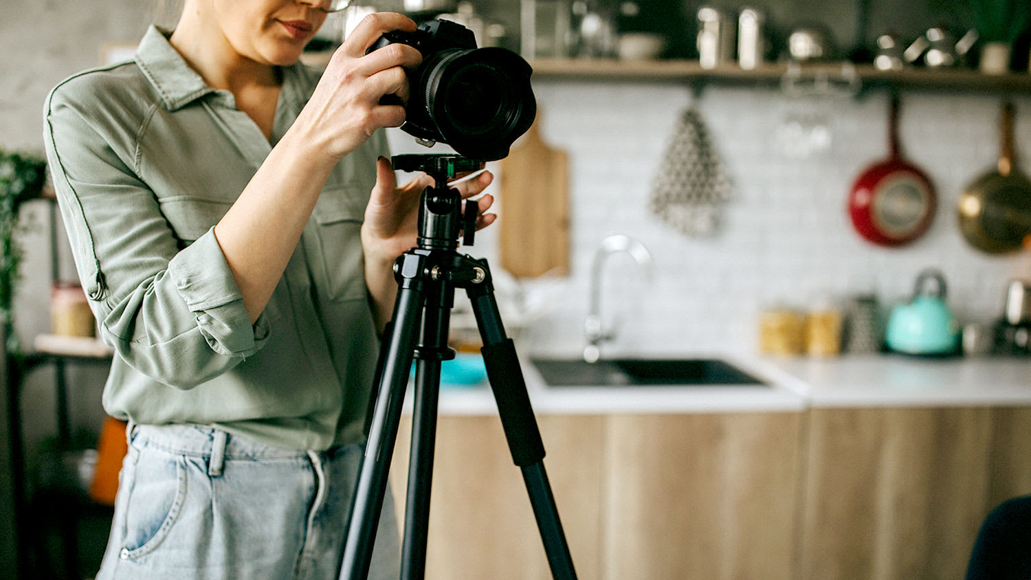 Woman photographing a house