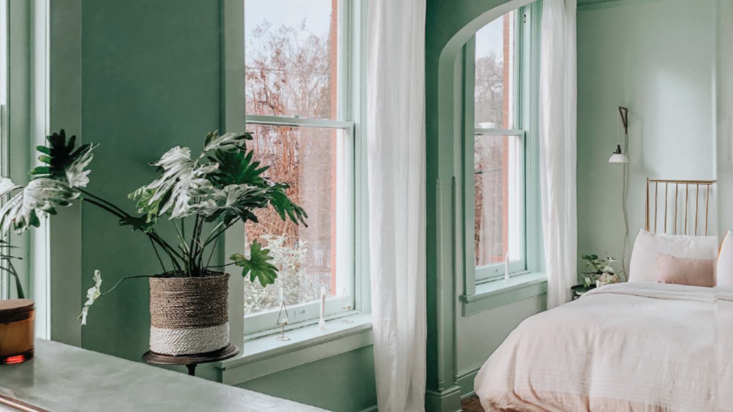 A bedroom with nature inspired walls