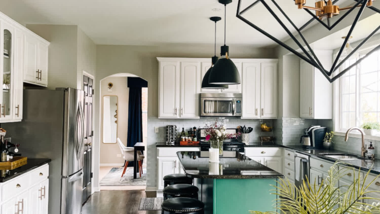A dining room with open kitchen