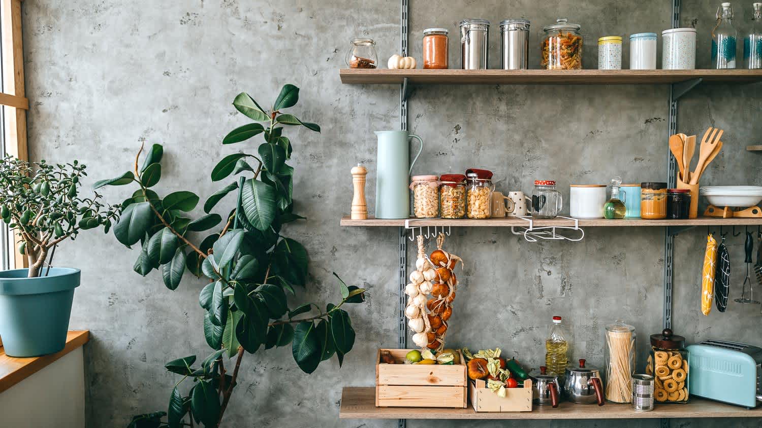 Kitchen jars with groceries stored on kitchen shelves