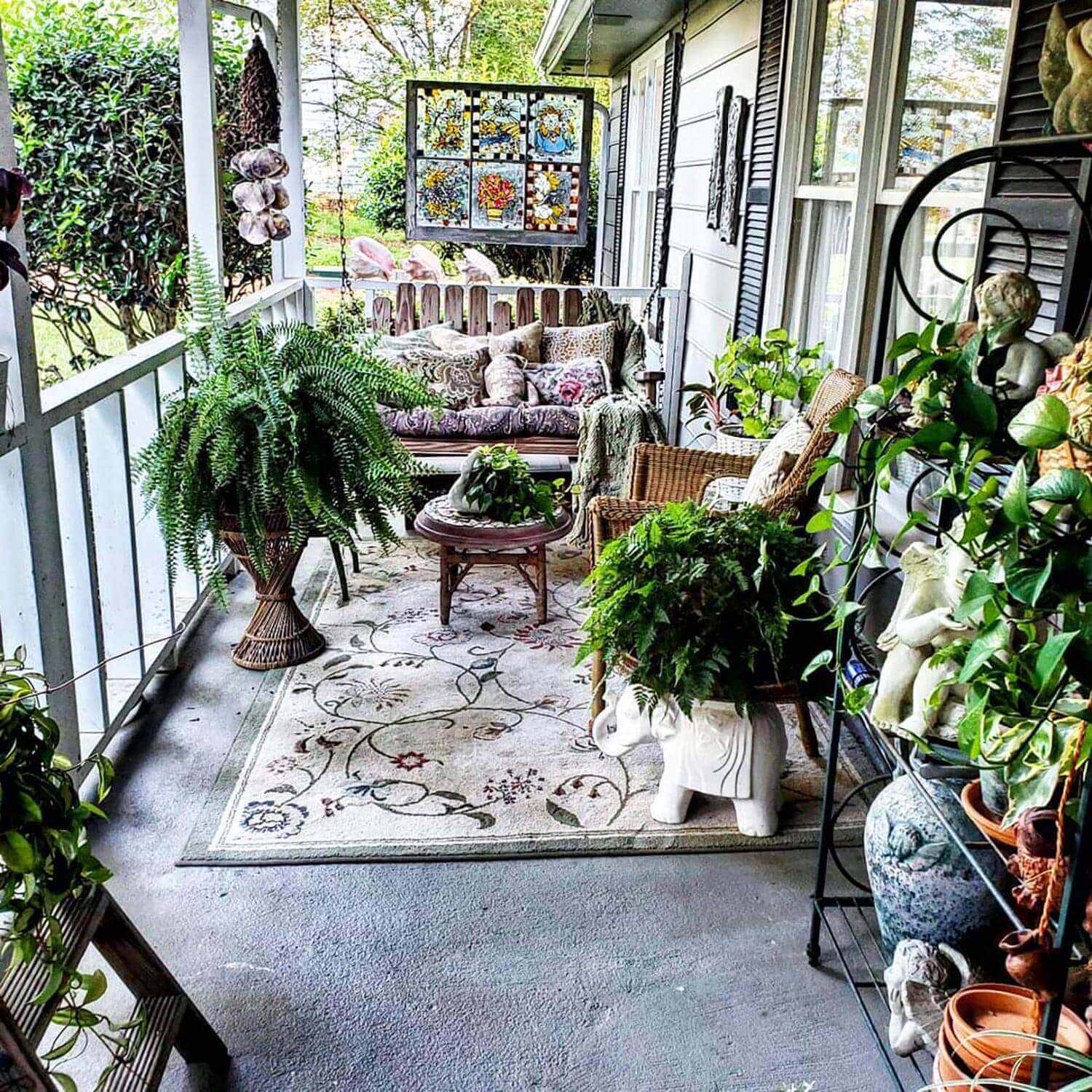 A porch with decorative finds and ferns