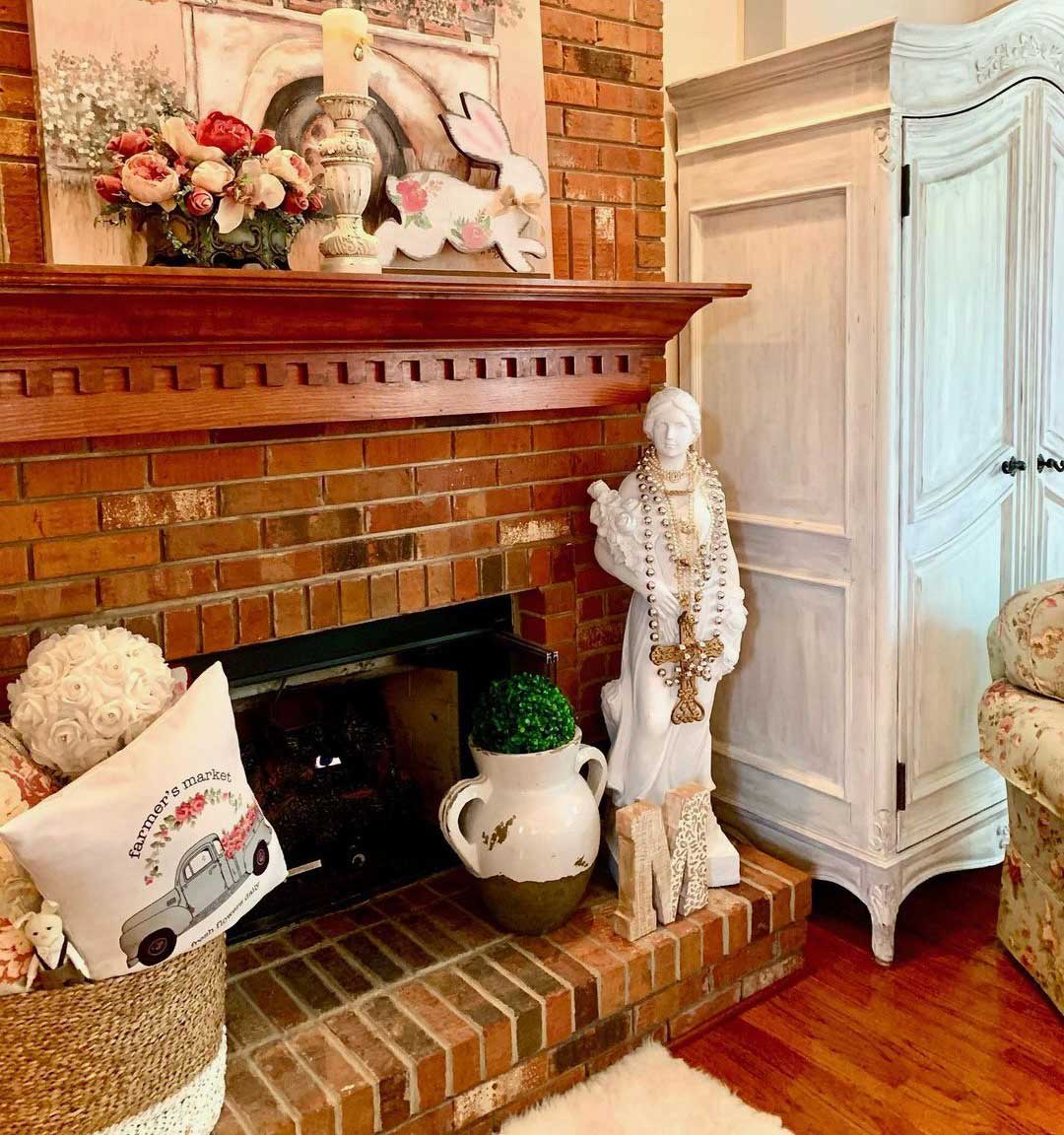 Brick fireplace surround with wooden mantelpiece
