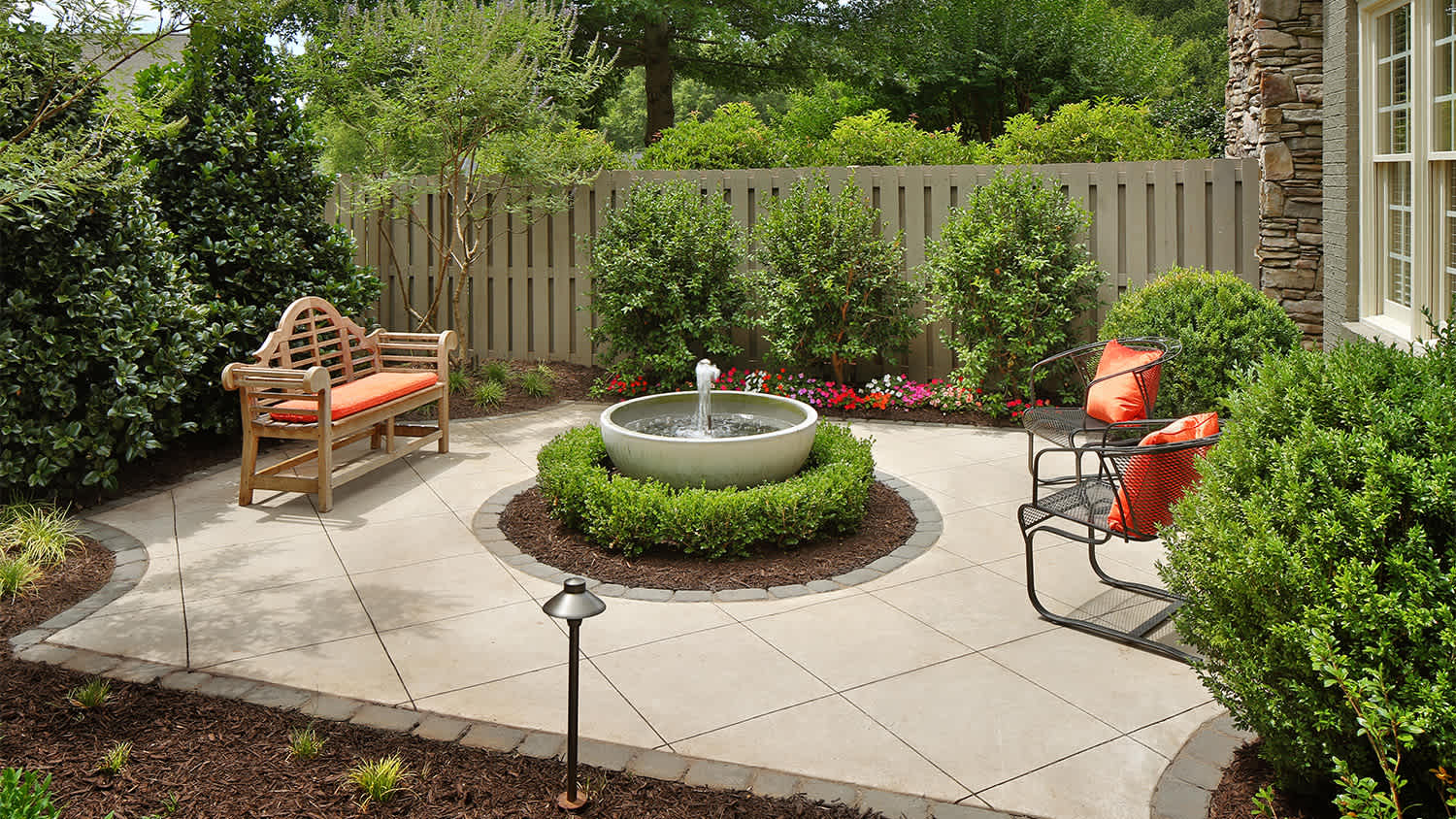 fountain in the middle of garden patio