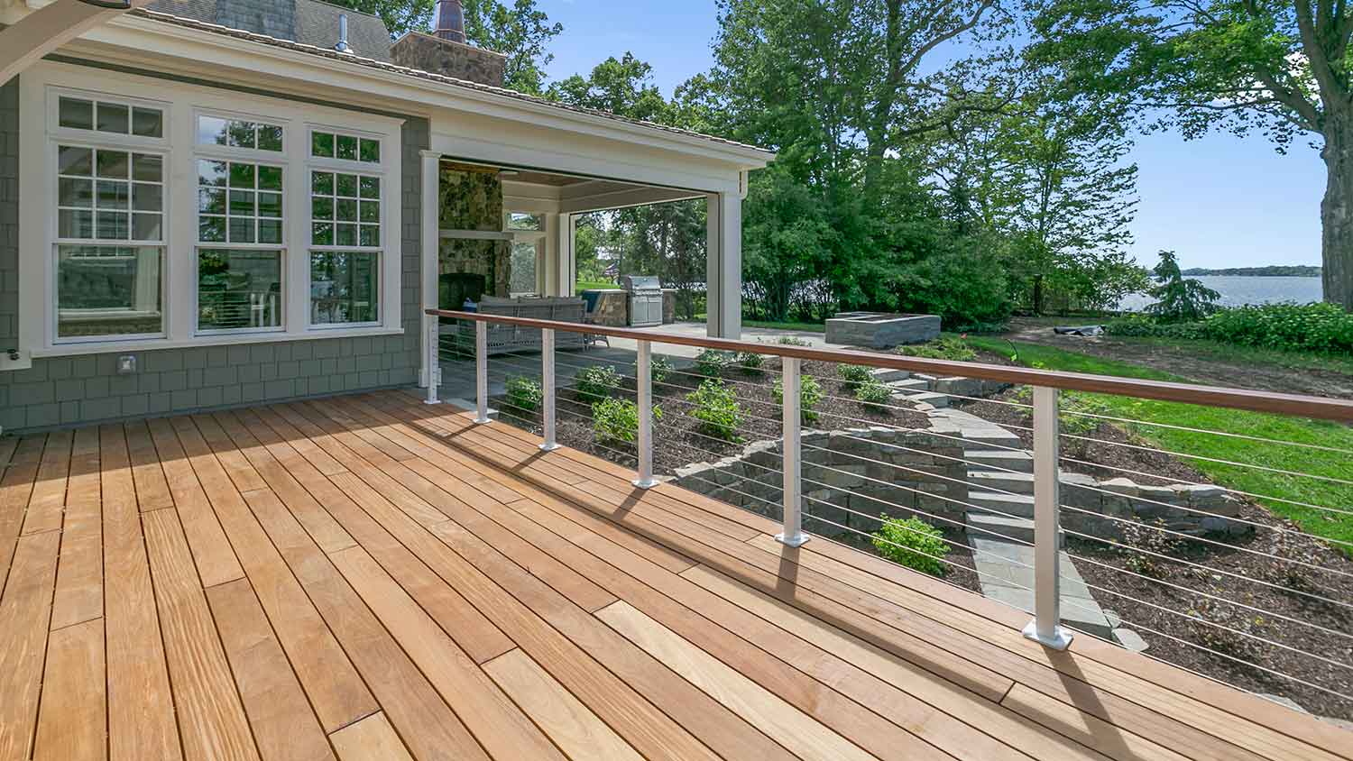 Lake house with  large wooden deck