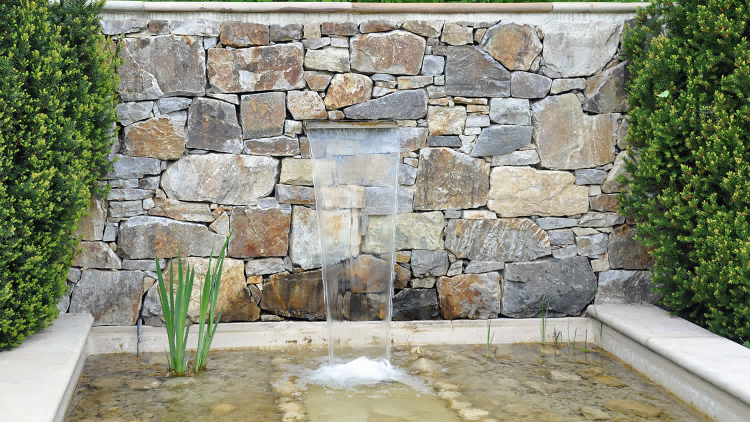 wall fountain in yard