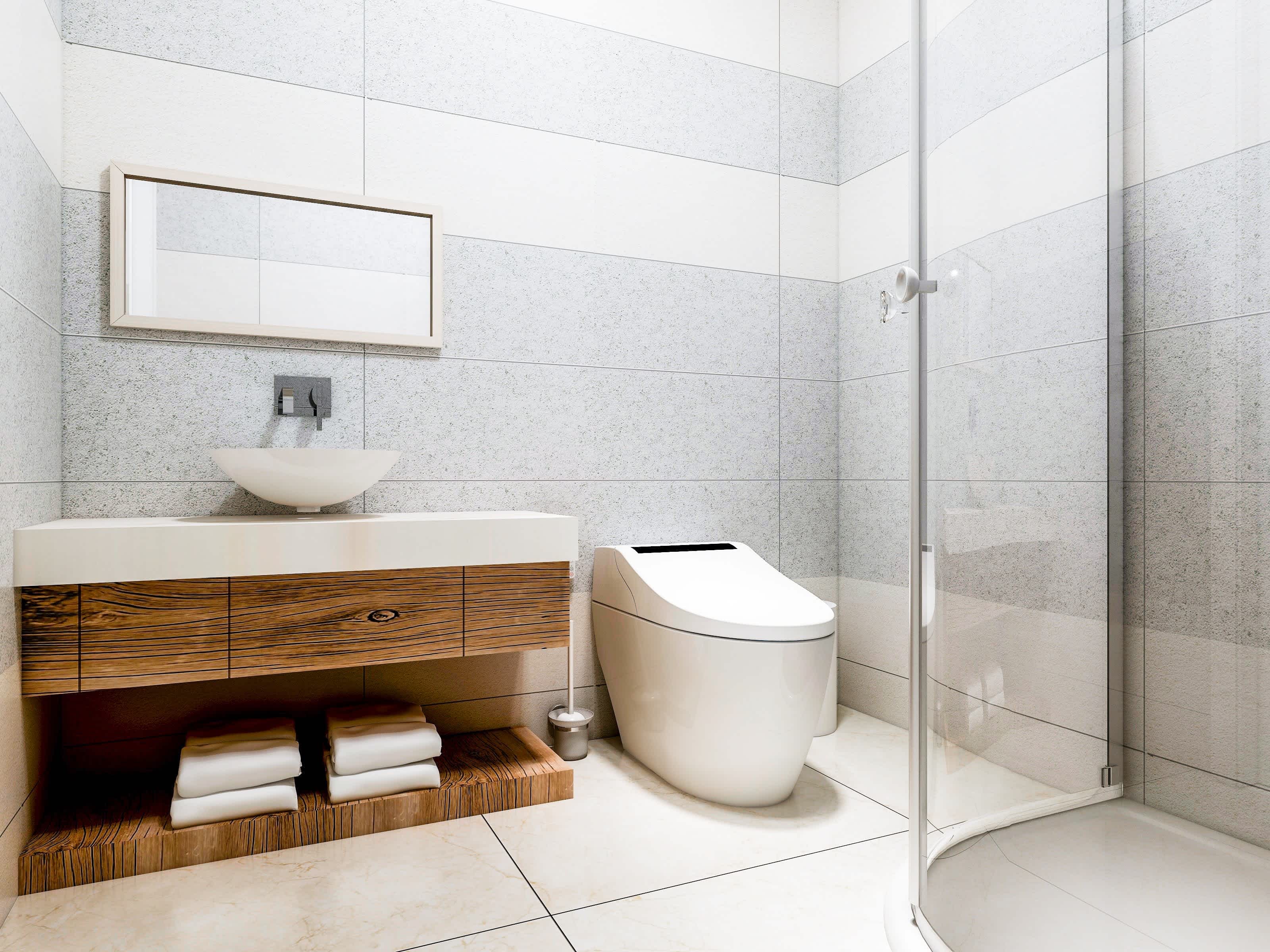 A clean and modern bathroom with a bidet