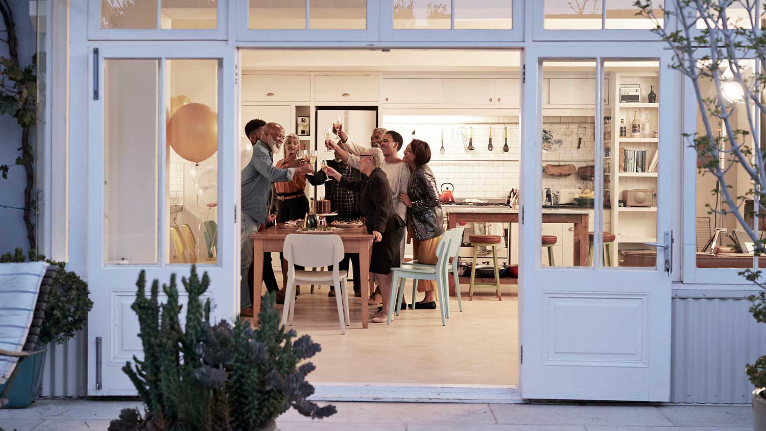 Cheerful family celebrating in dining room