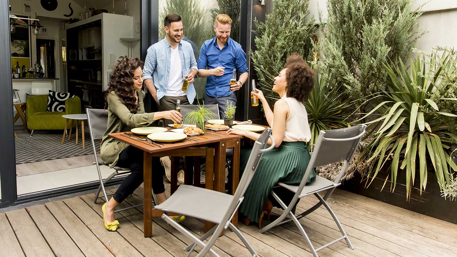 Group of friends having a reunion on the patio