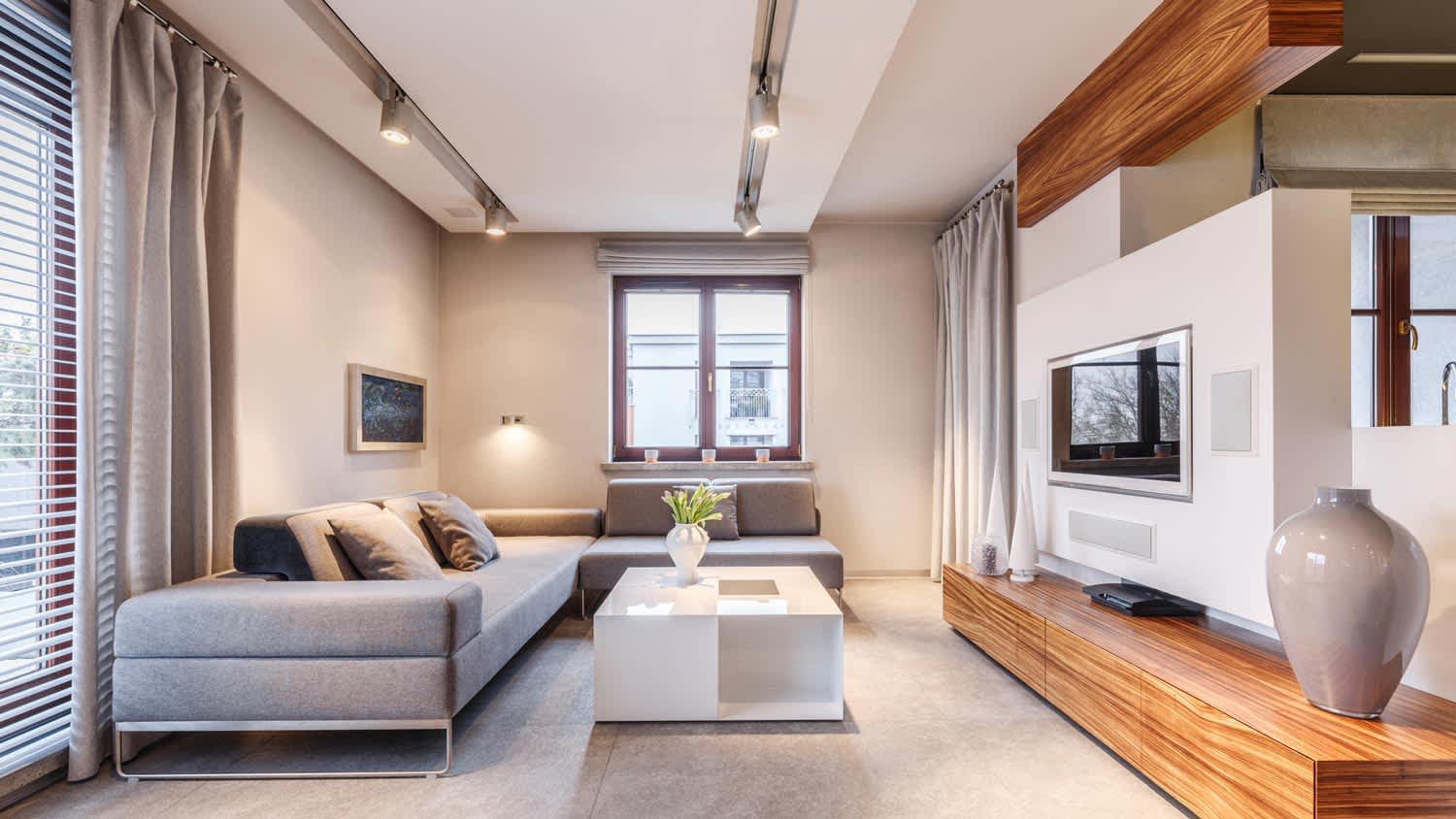 The interior of a living room with a drop ceiling