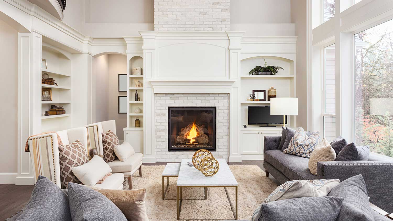 Open concept house with white brick fireplace