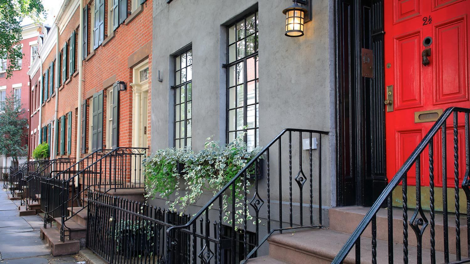 A gray historic brownstone townhouse
