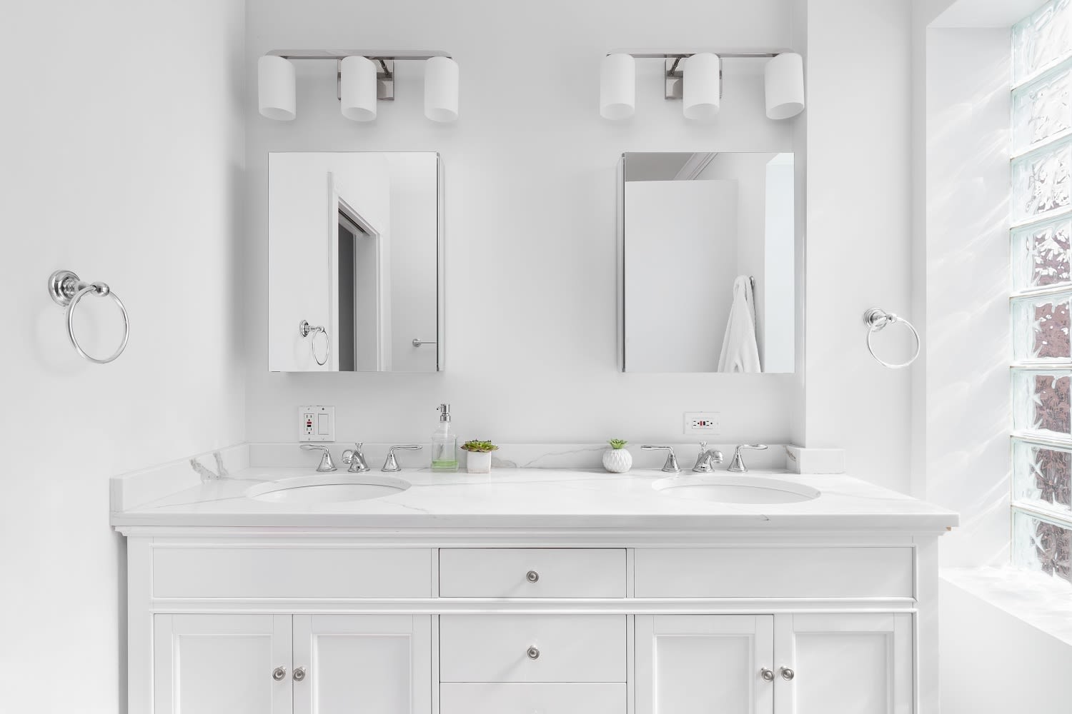 A white double sink vanity