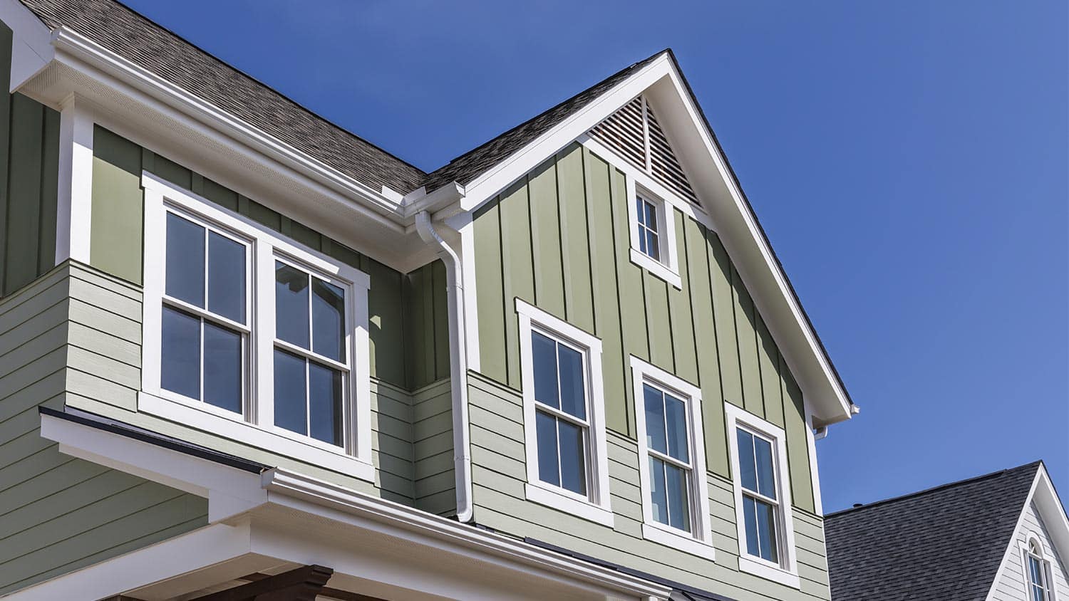Exterior of house with green siding