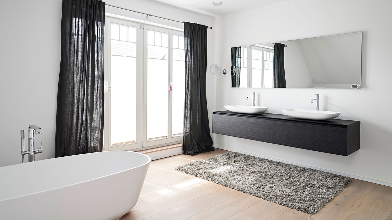 White bathroom with black curtains