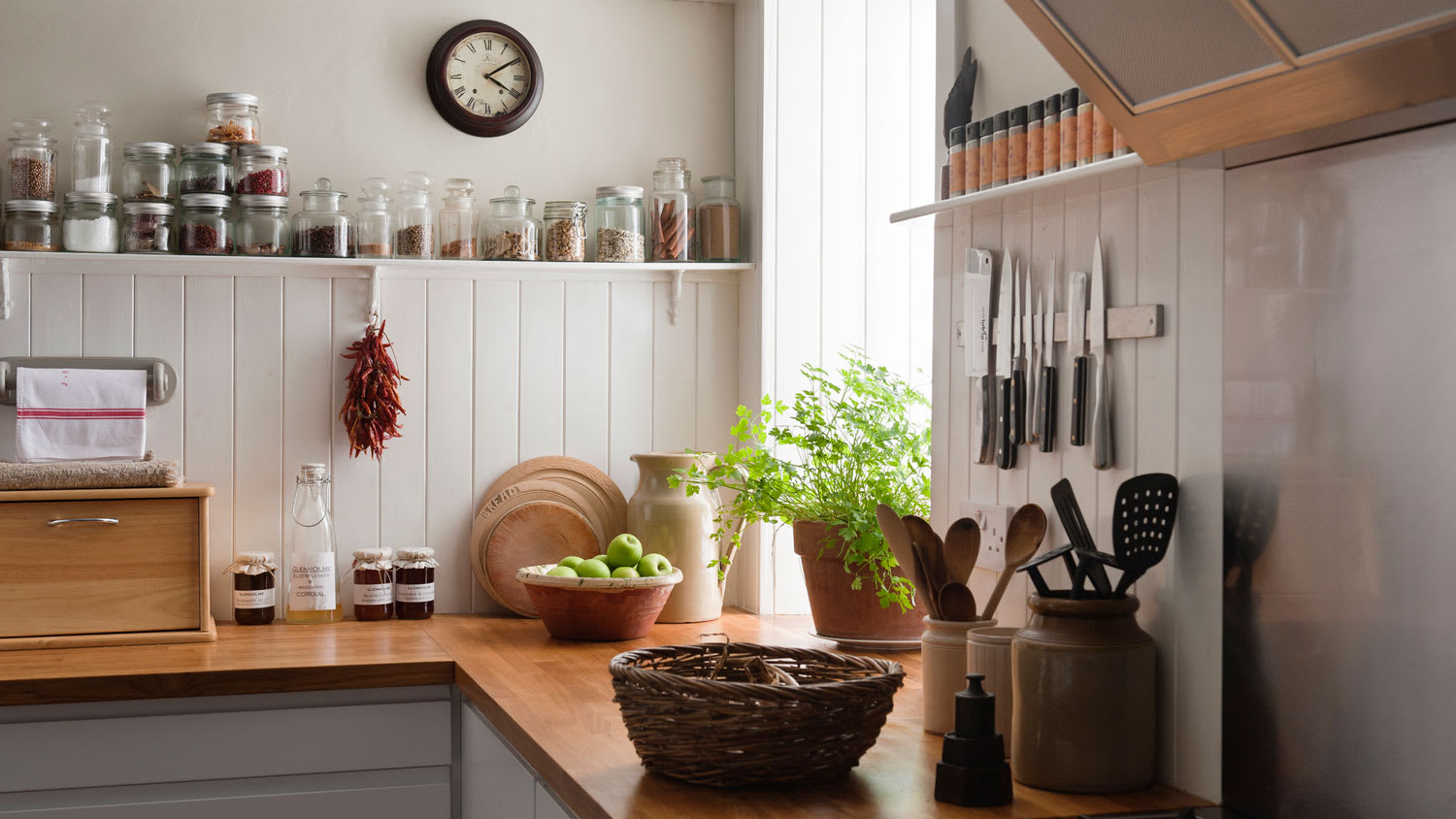 Open shelving and solid oak countertop in a kitchen
