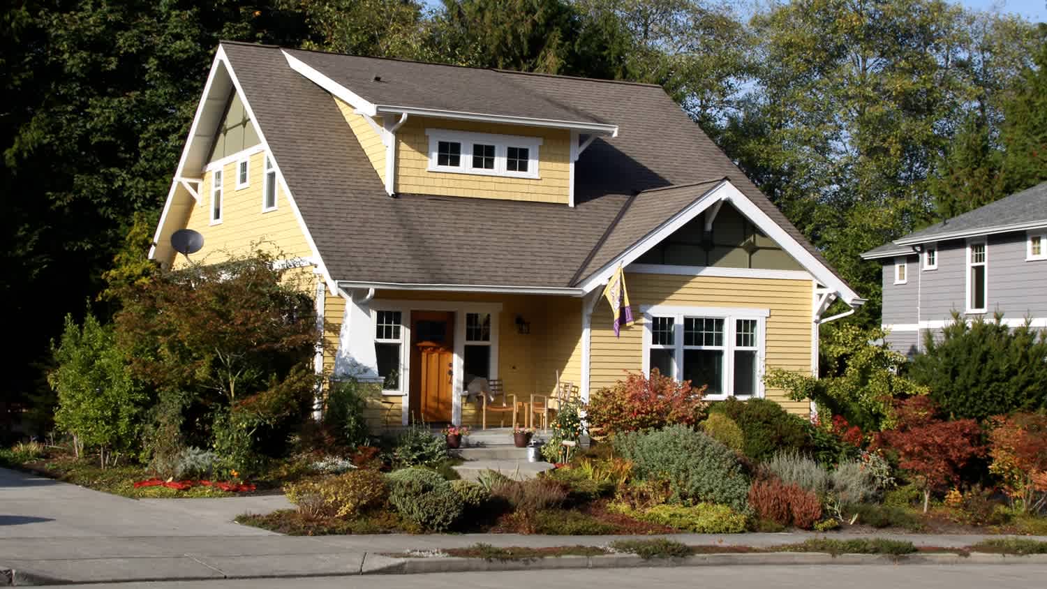 A two-story house with yellow siding