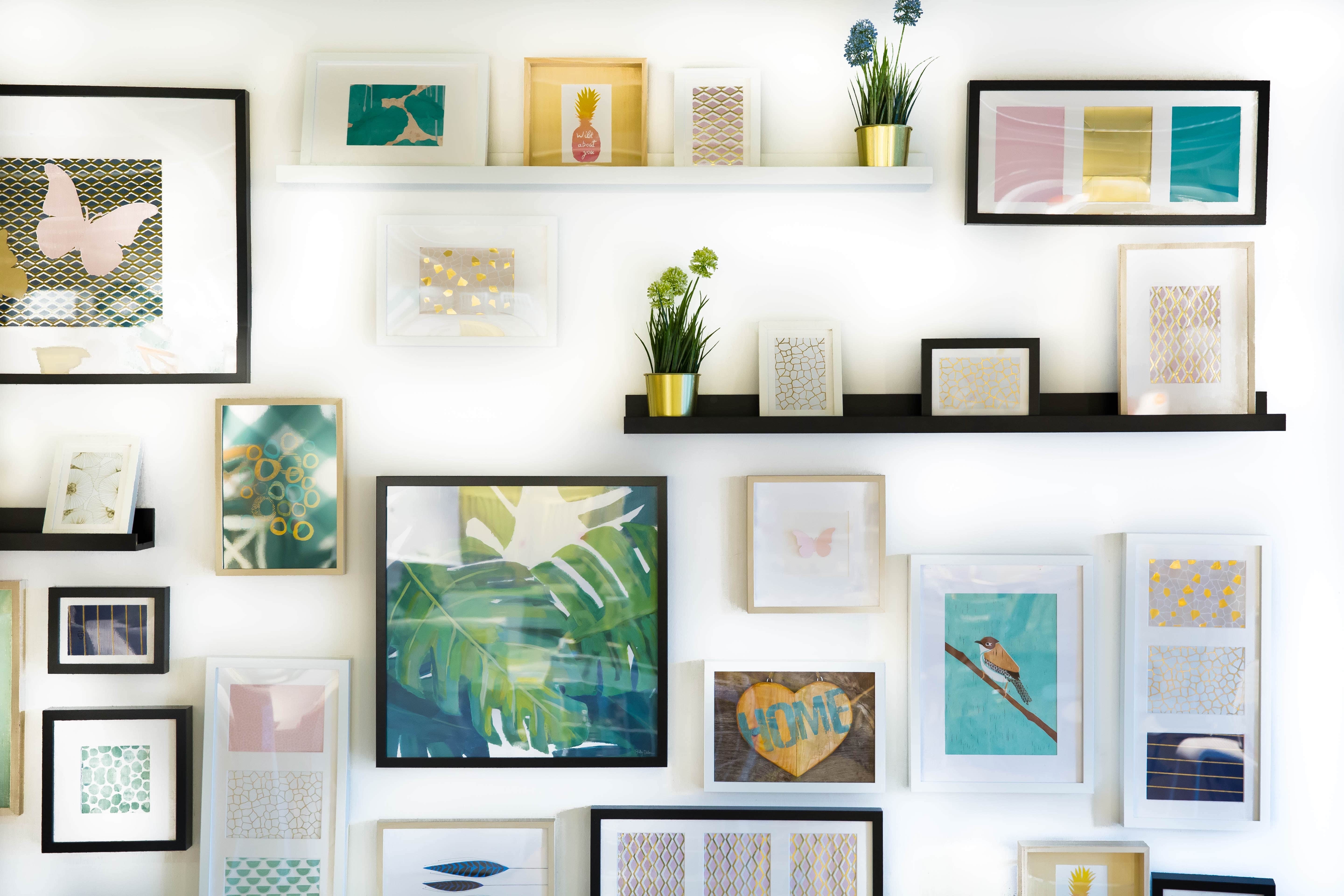 Assorted-color framed paintings on the wall
