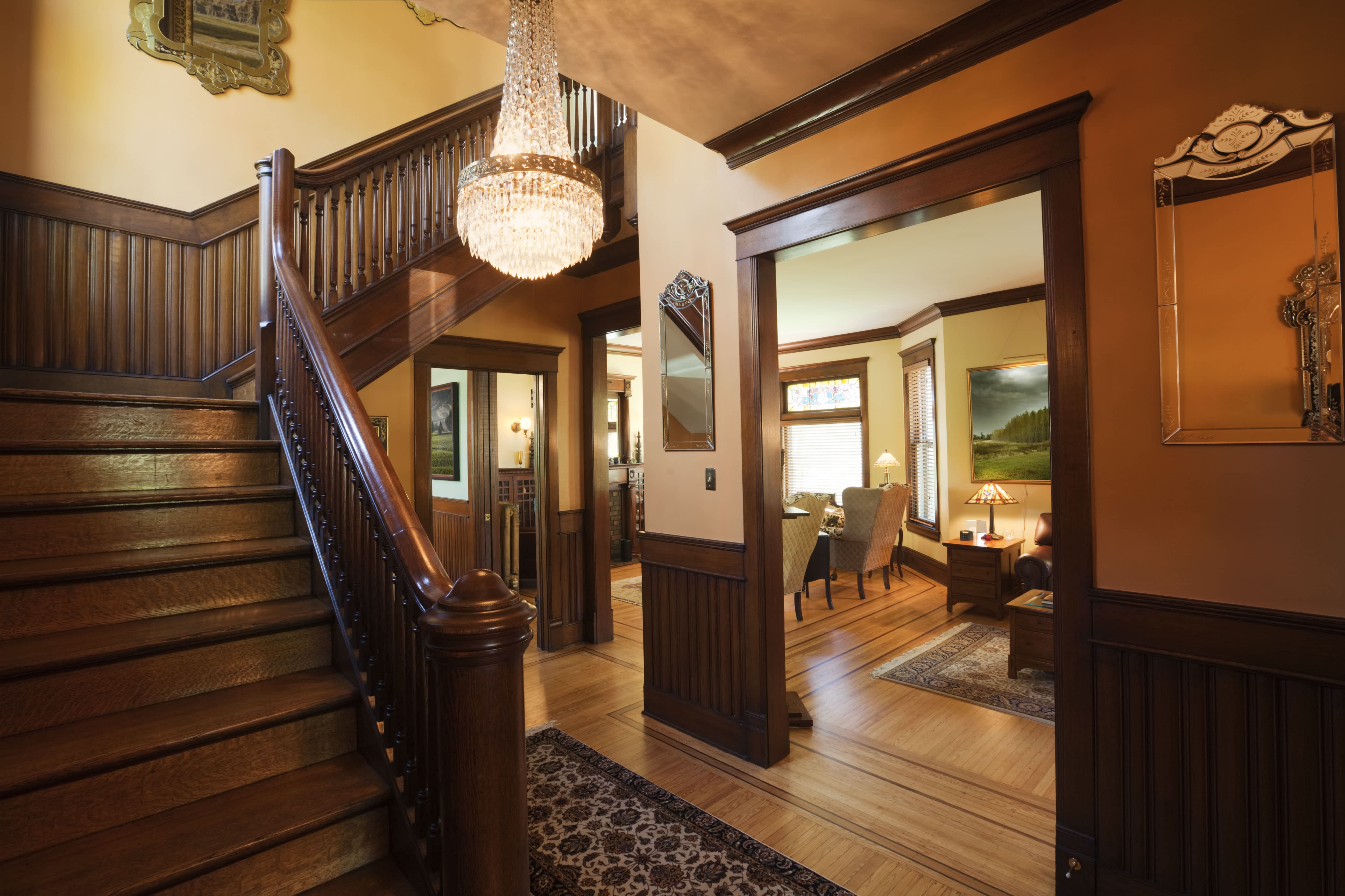 Entryway of Victorian home lined with mahogany wainscoting