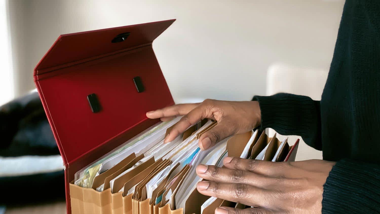 Woman going through her files in home office