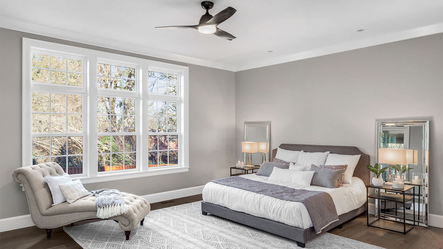 grey bedroom with ceiling fan