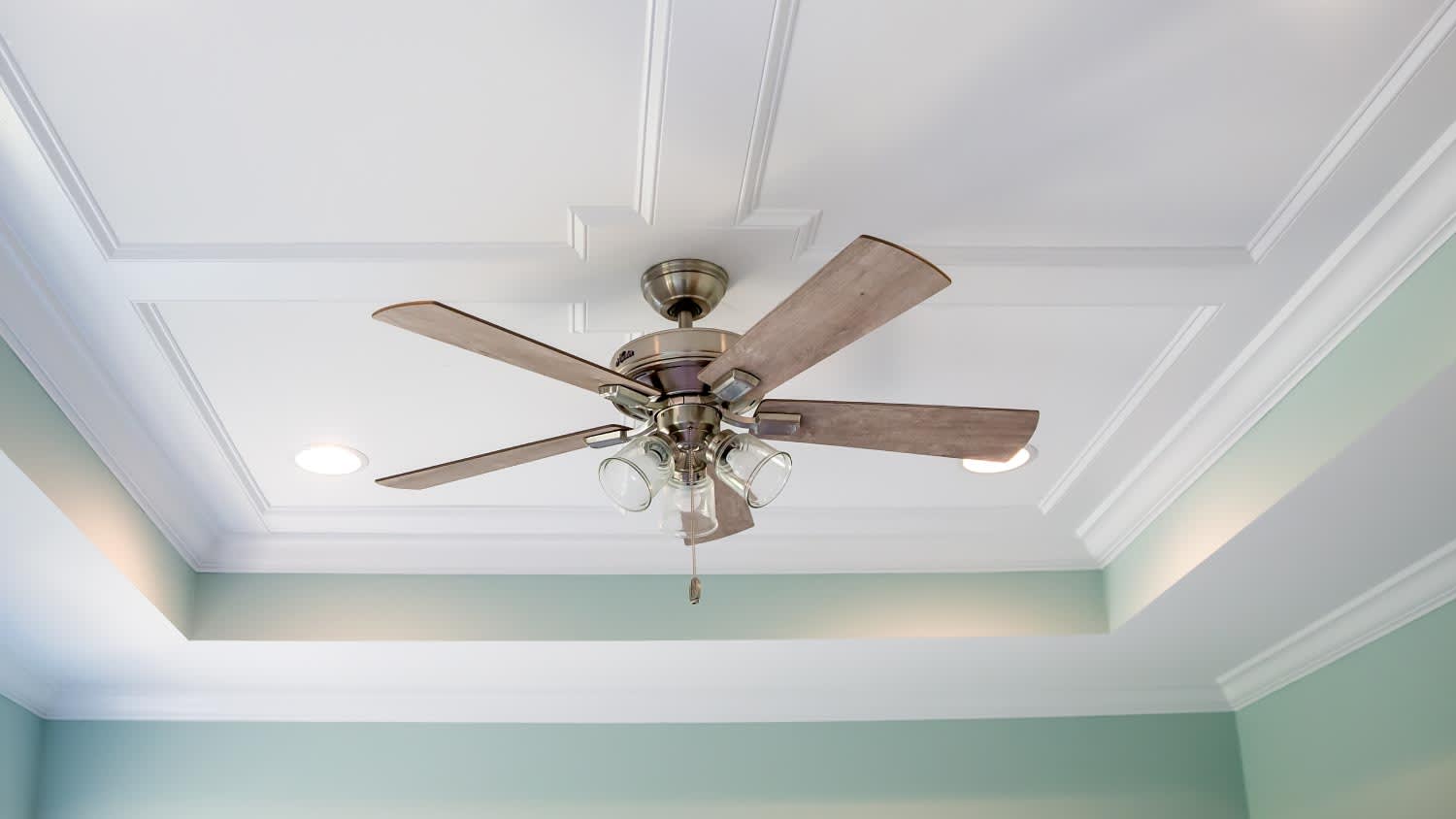 Ceiling fan and pale blue turquoise walls