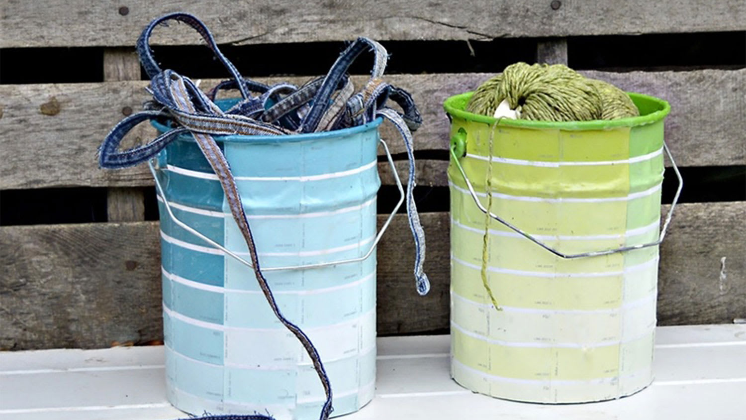 Paint cans covered in paint chips