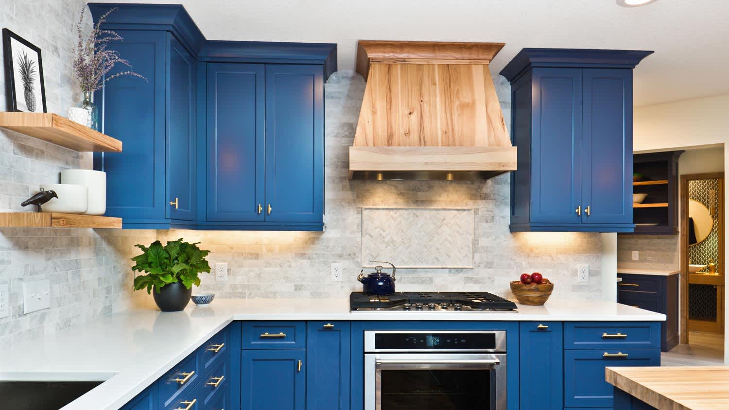 A contemporary kitchen with blue cabinets