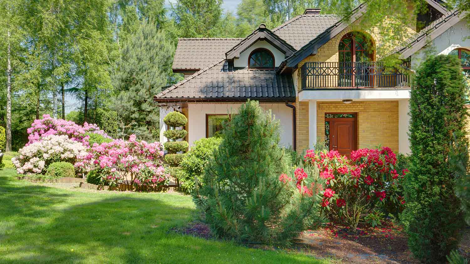 Two story house with well-maintained backyard