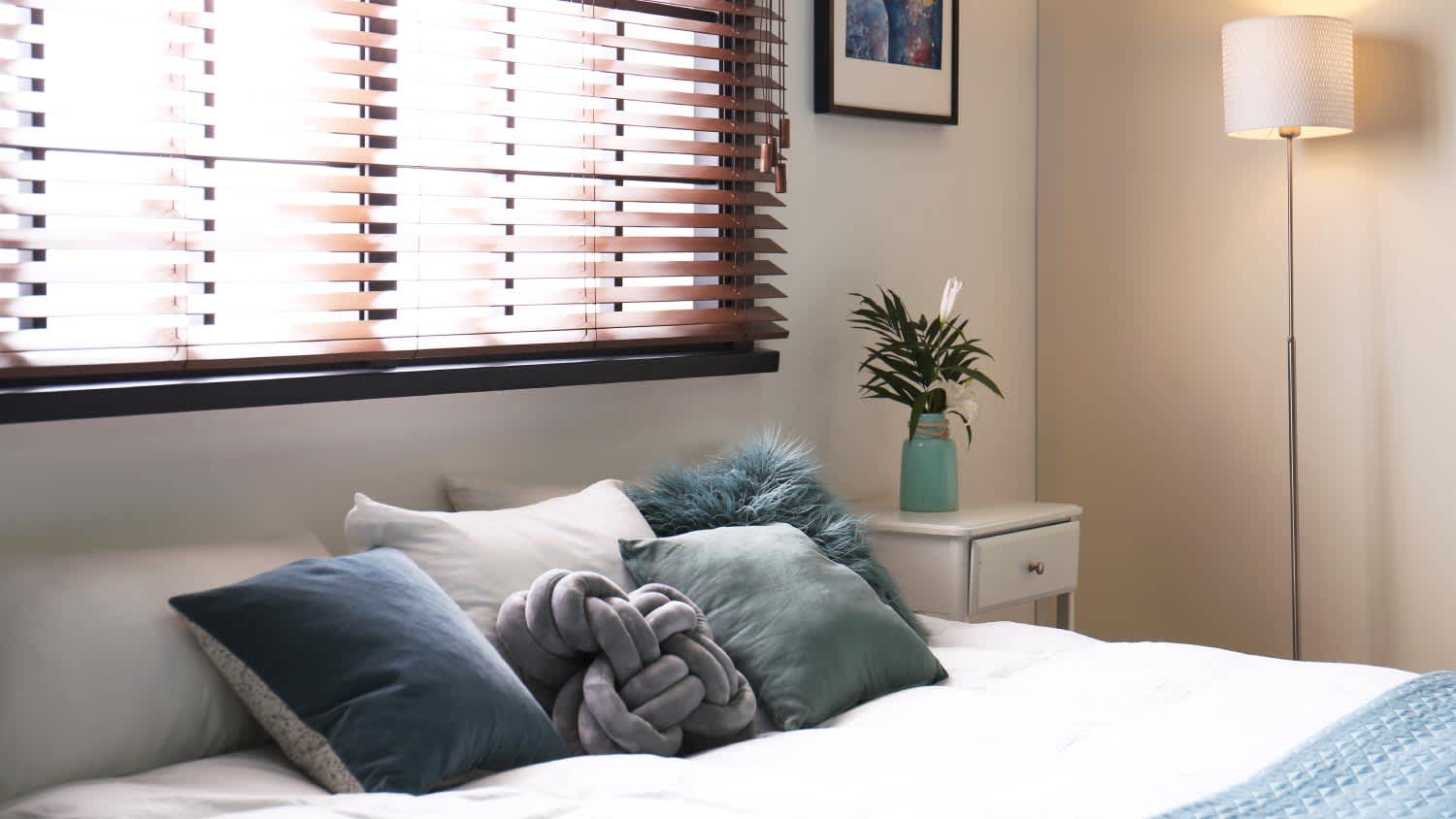 A bedroom with blinds