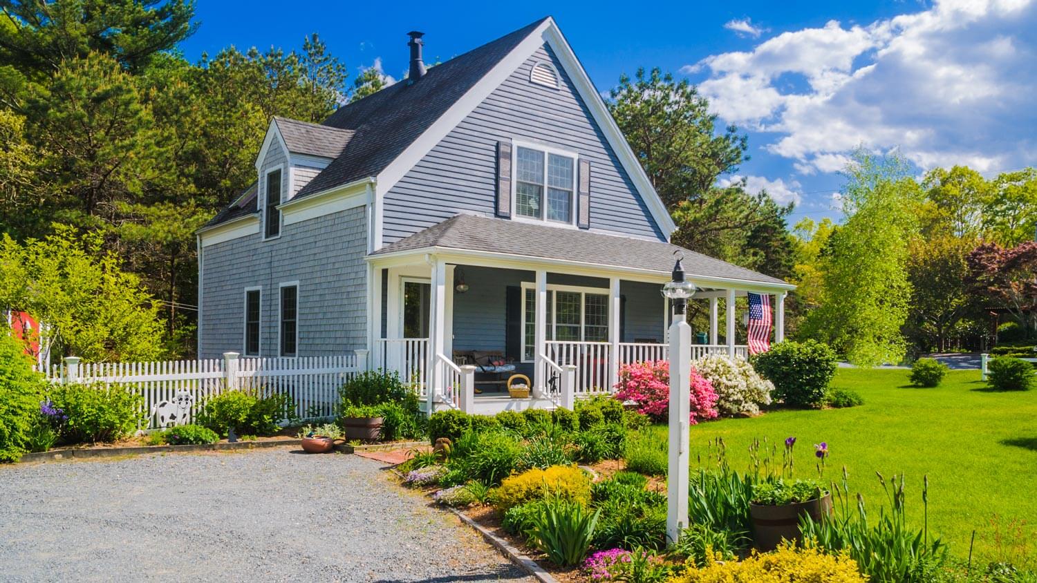 A house’s front yard with blooming flowers
