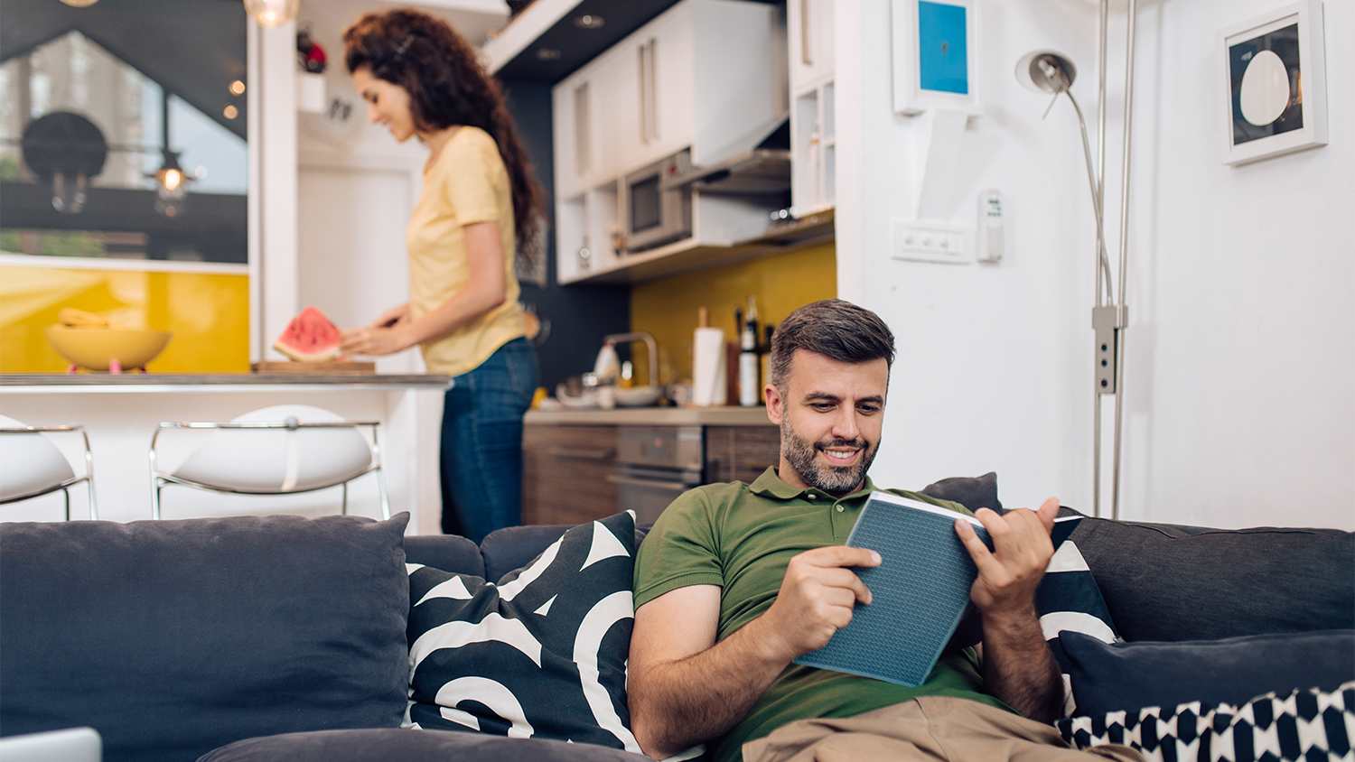man and wife relaxing at home