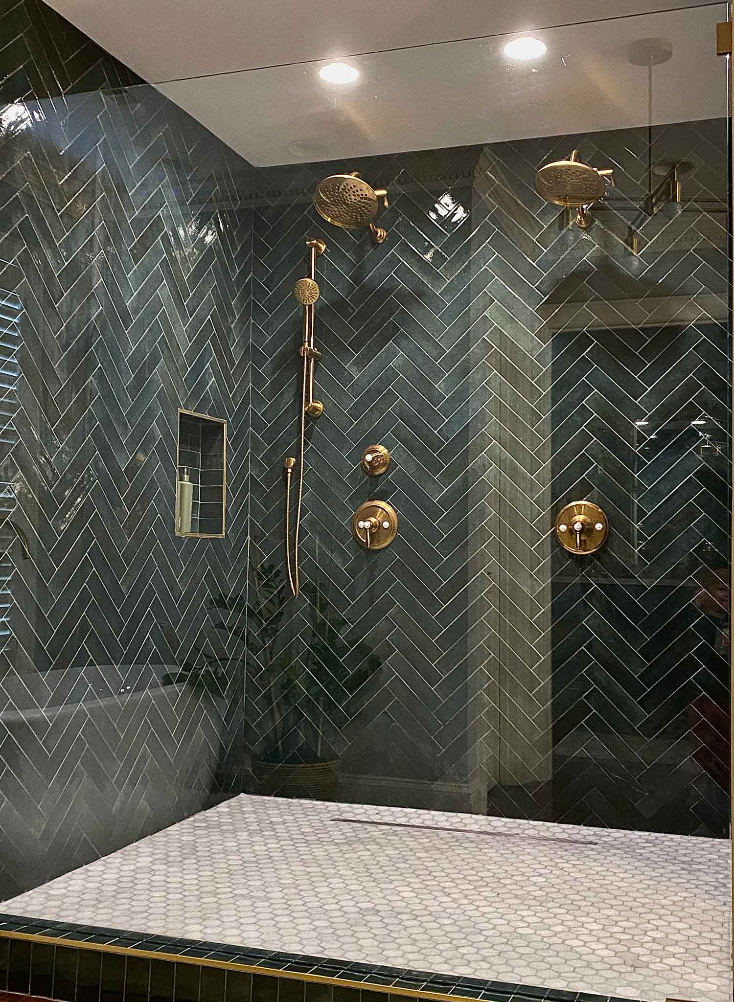Shower with double showerhead and green tiles